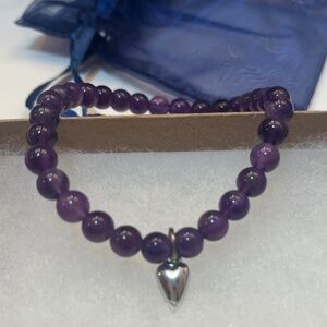 Purple amethyst beaded bracelet with silver heart accent 7”